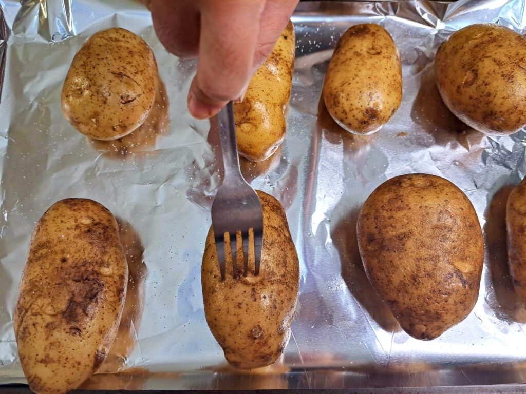 Poke the potatoes before baking.